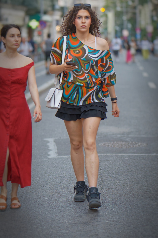 Girl in a retro 1970s-inspired aesthetic mixed with casual athletic streetwear